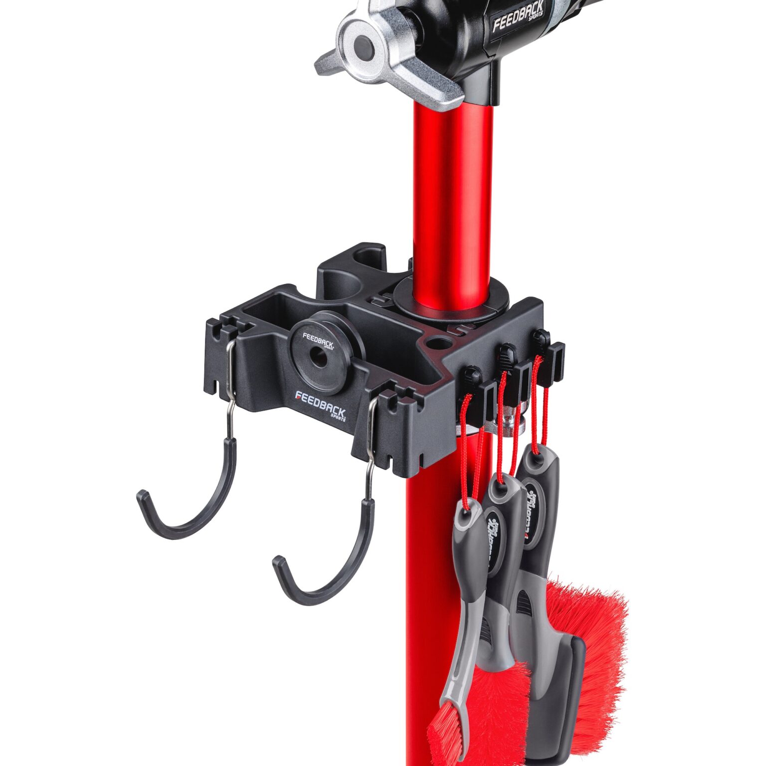 studio image of everything included in the Feedback Sports Brush Bar kit mounted on a repair stand