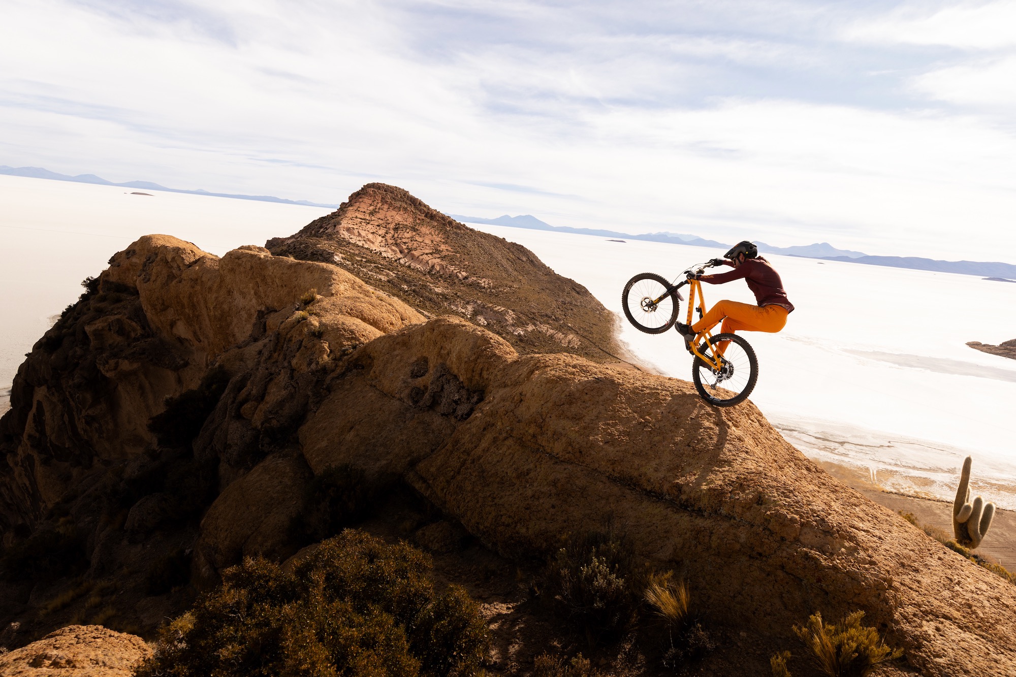 Killian Bron riding on a ridge in some exotic location for Mirage.