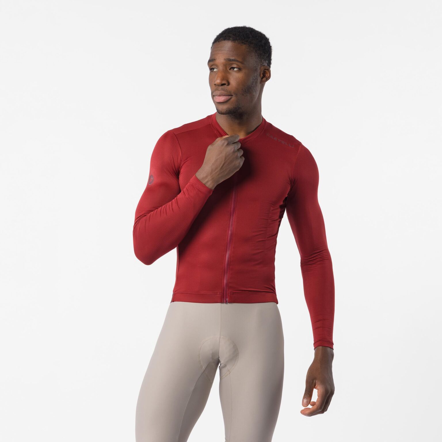 studio image of a man wearing the Espresso 2 LS Jersey viewed from the back