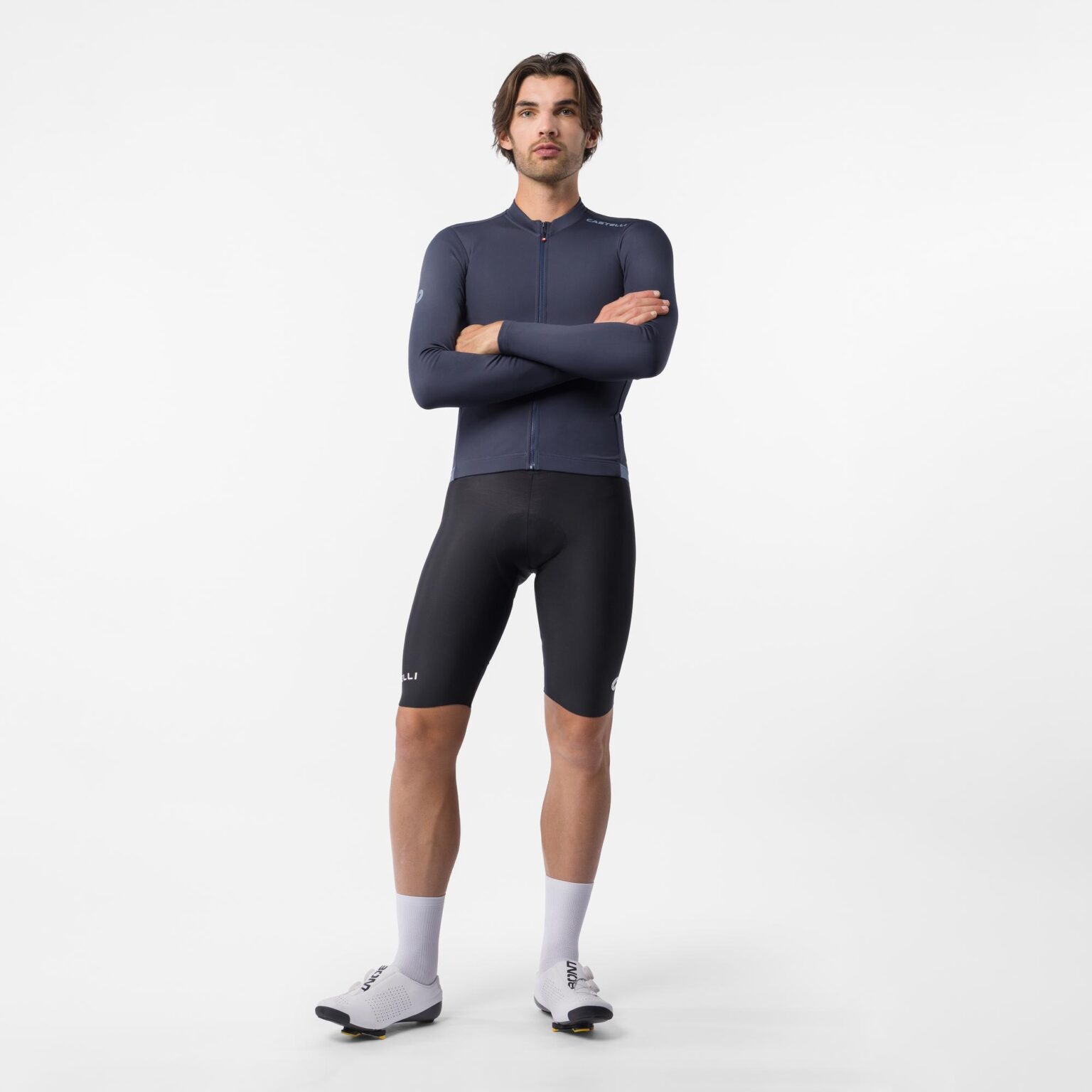 studio image of a man wearing the Espresso Thermal bibshorts