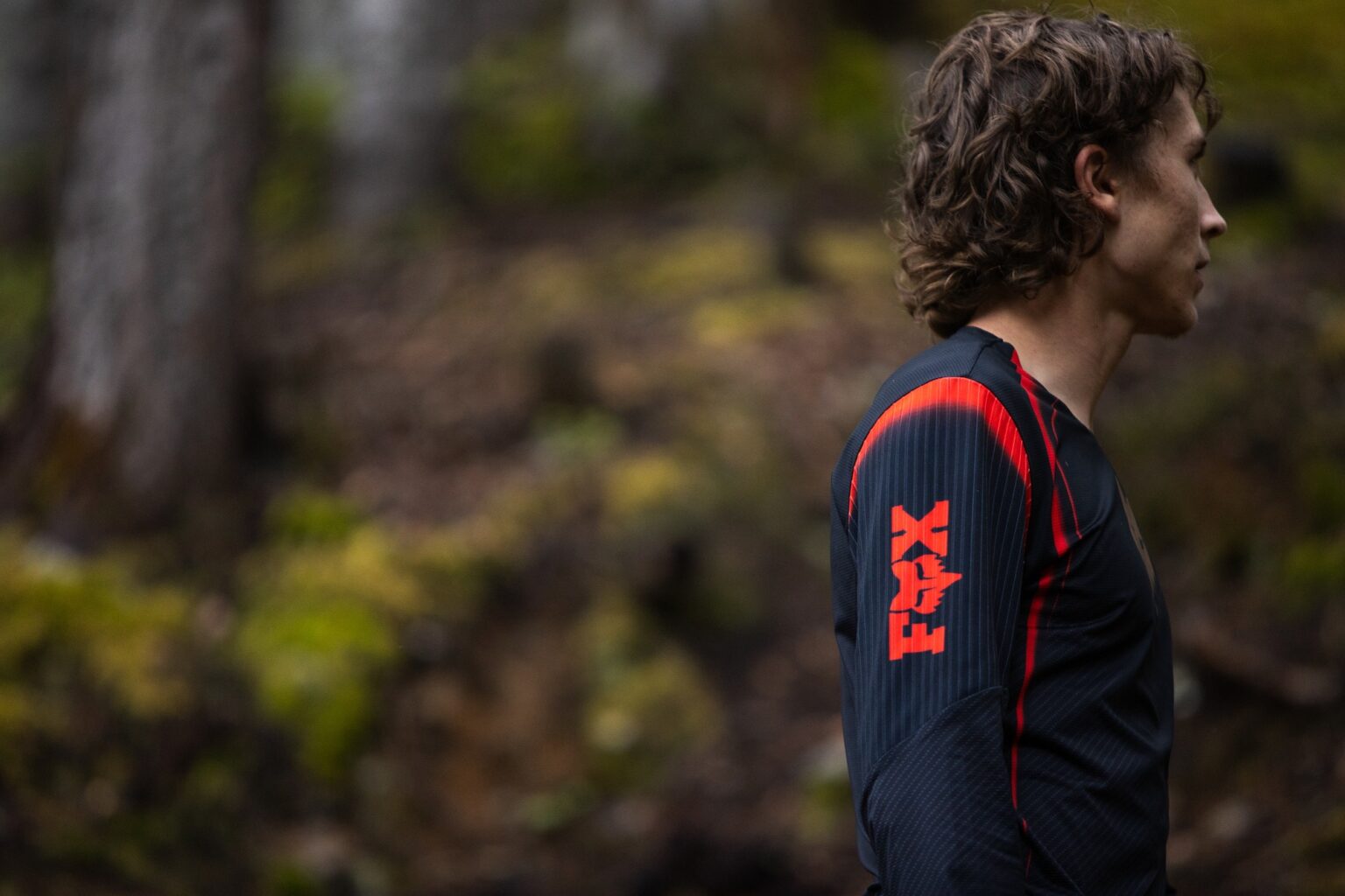jackson goldstone standing outside while wearing his new Signature Collection Jersey