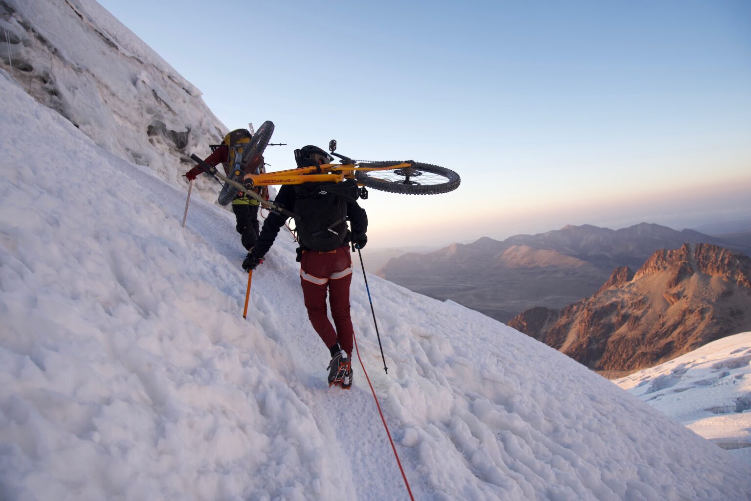 Killian Bron climbing Huayna Potosi with a bike on his back