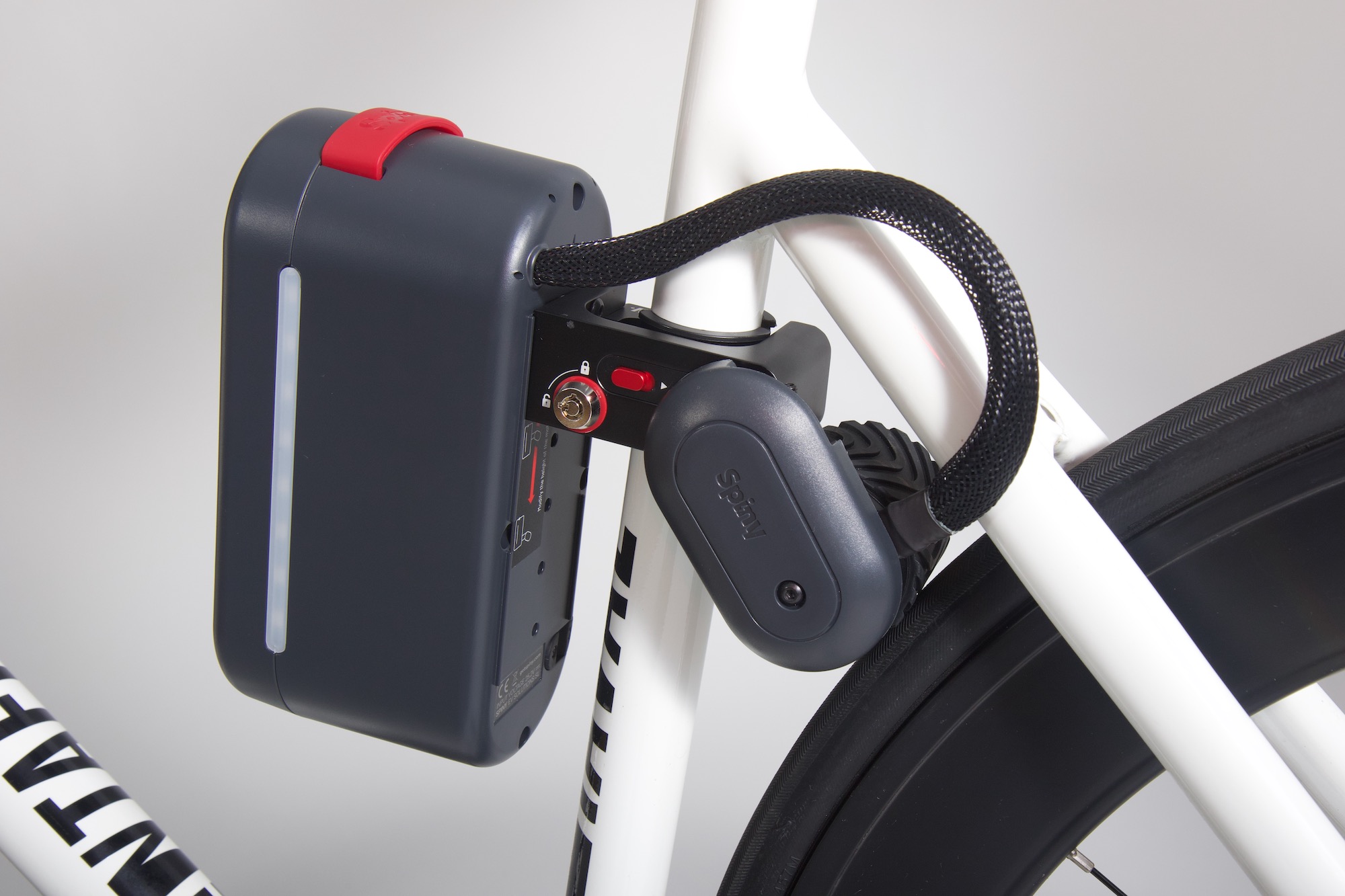 studio image of the Spiny 2 mounted on a bike with a white frame