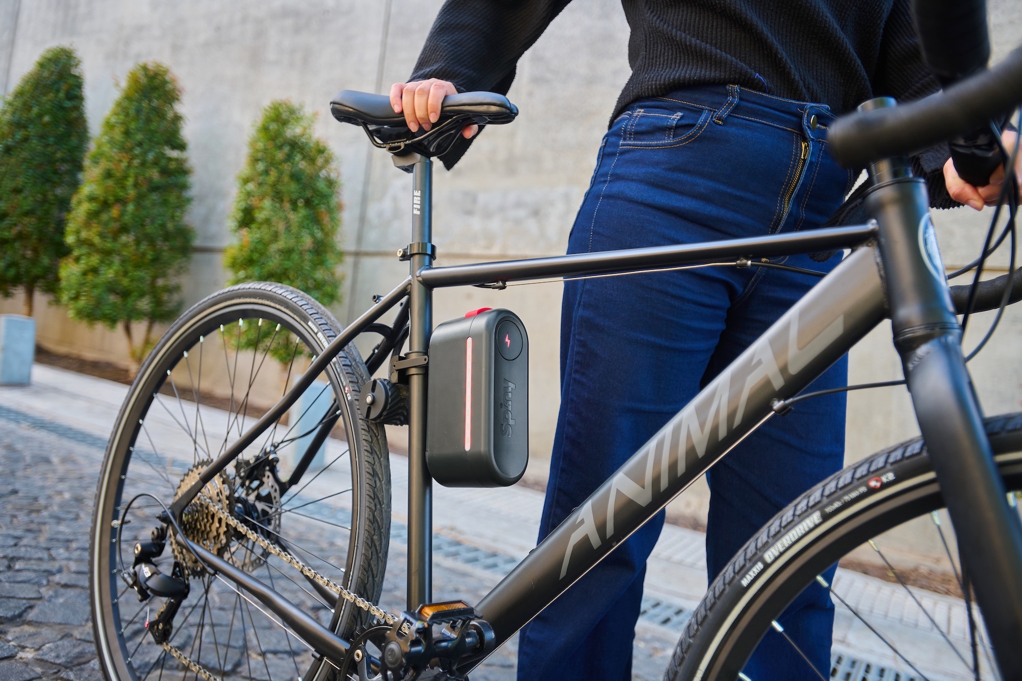 the Spiny 2 mounted on a bike with a person holding the bike outside
