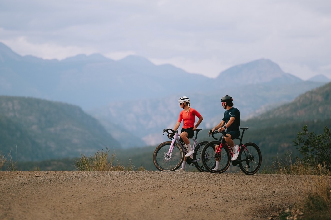 a man and woman on gravel bikes with WTB CGR i28 wheels standing and looking at a view