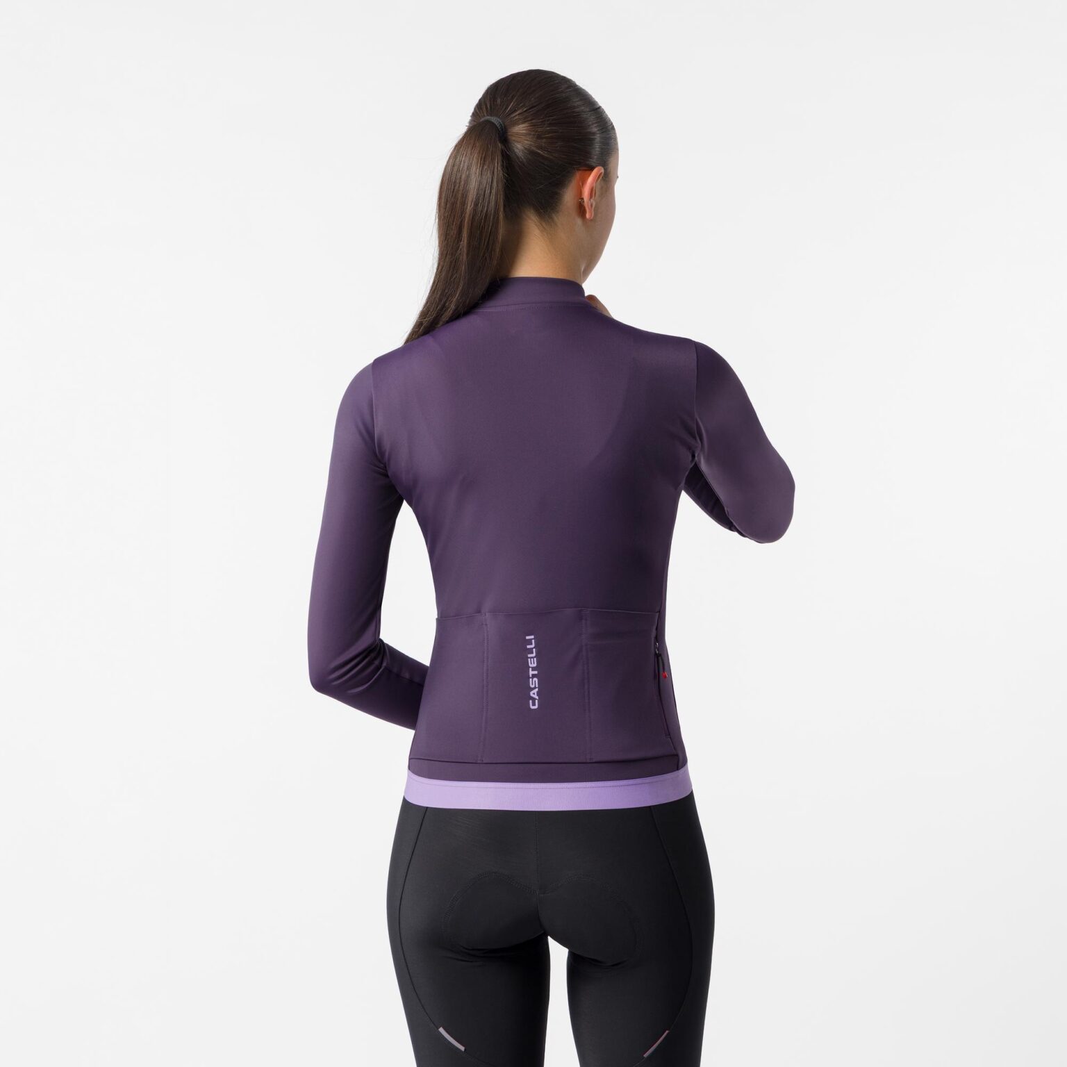 studio image of a woman wearing the Espresso 2 LS Jersey viewed from the back