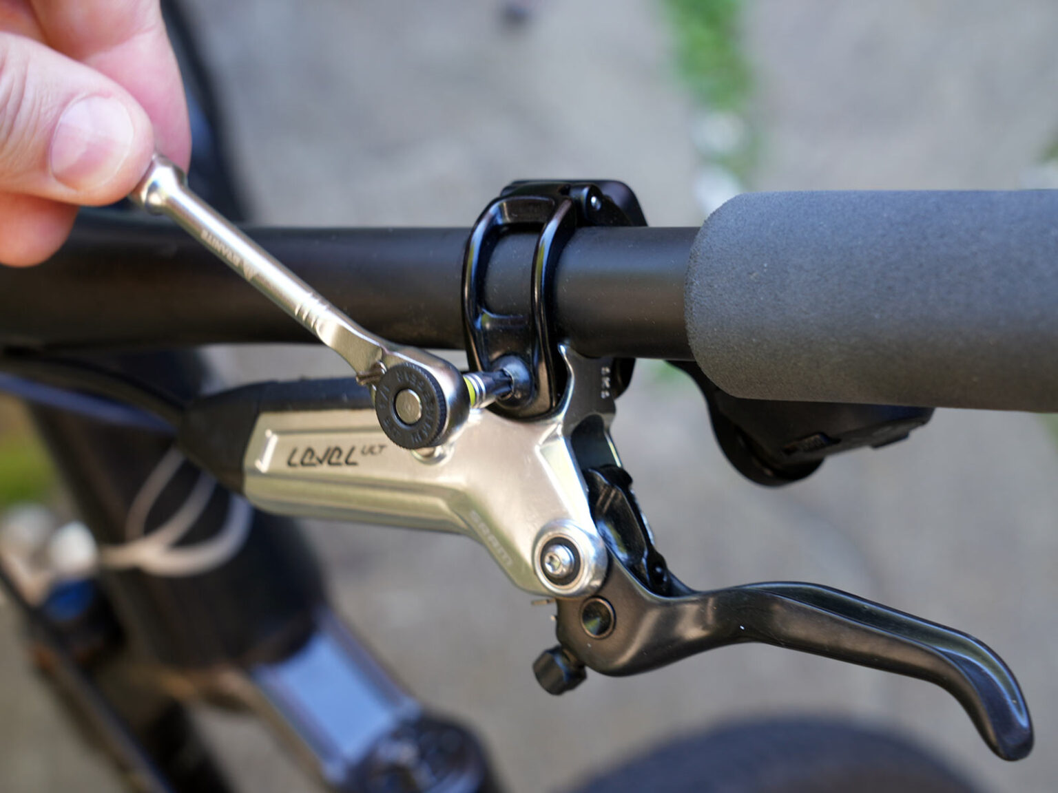 granite stash rt mini tool being used for bicycle repairs.