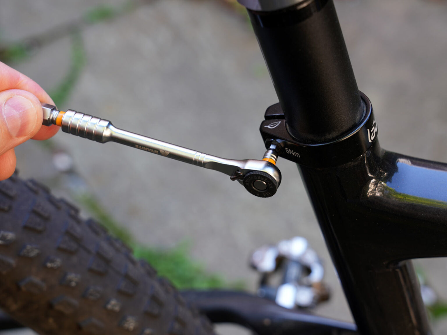 granite stash rt mini tool being used for bicycle repairs.