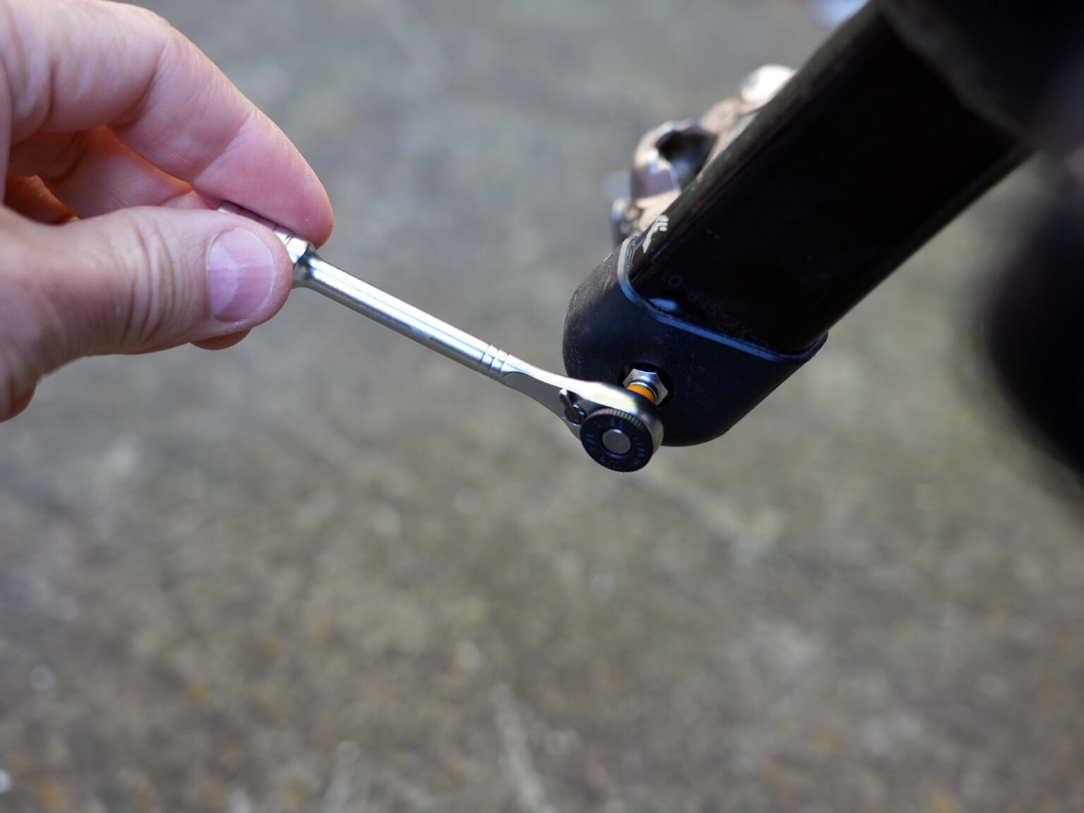 granite stash rt mini tool being used for bicycle repairs.