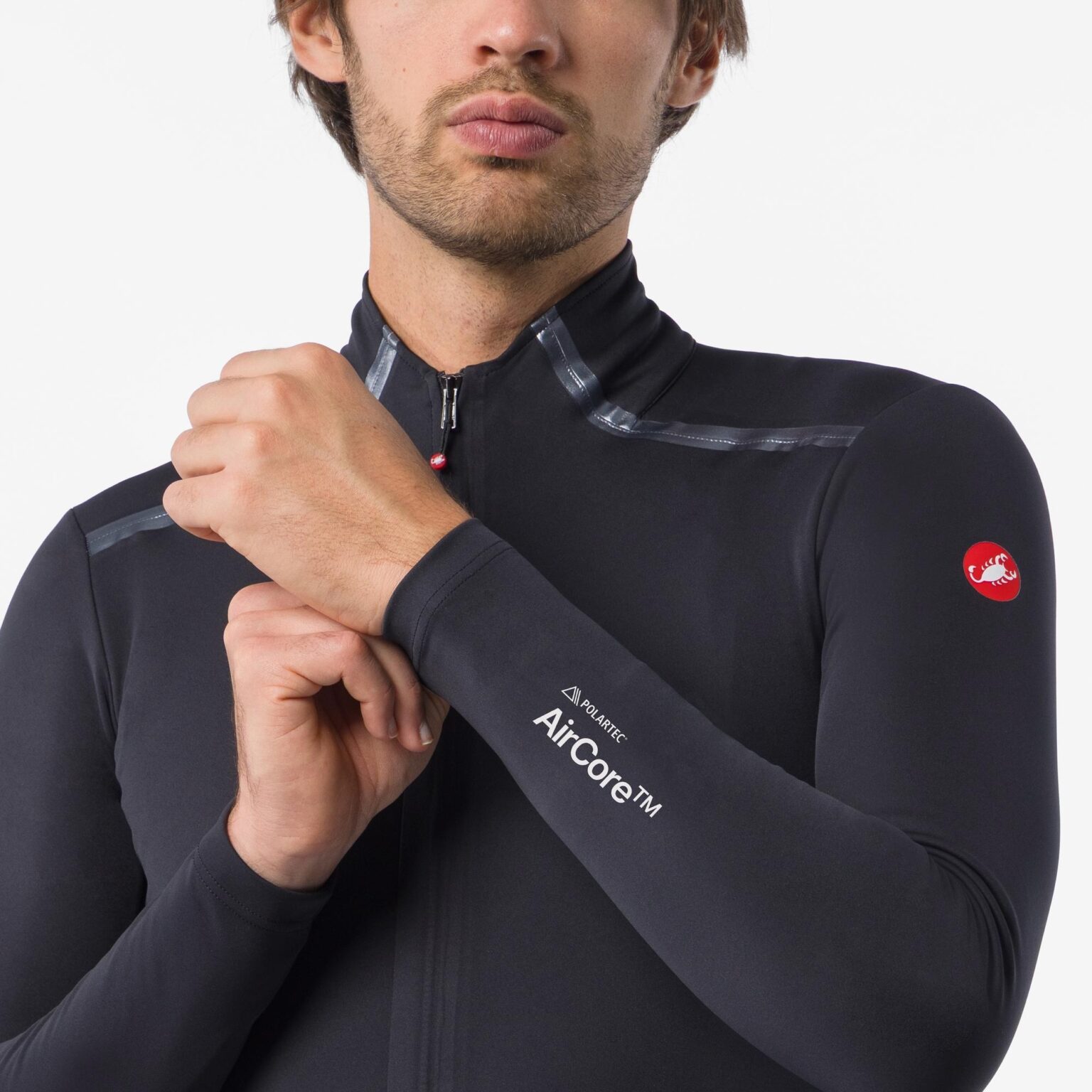 studio image of a man wearing the Perfetto Pro jacket showing the AirCore logo and the tansparent tape on the shoulders