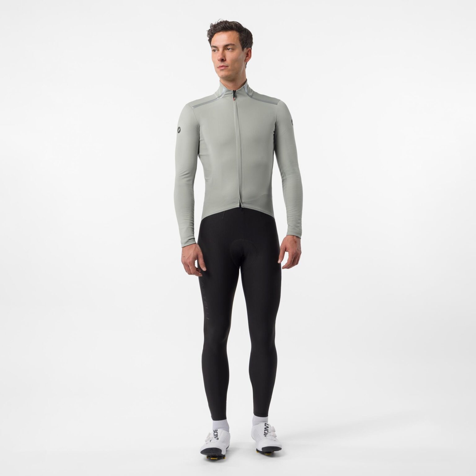 studio image of a man standing wearing the new Castelli Perfetto Pro jacket, showing the full body
