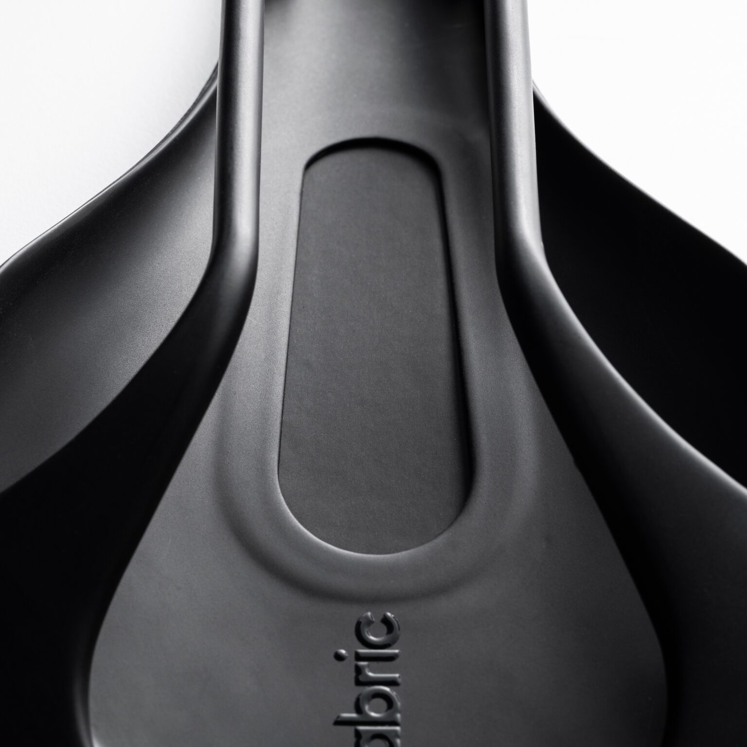 studio image of the Fabric ALM:HALO Ergo saddle base with cutout
