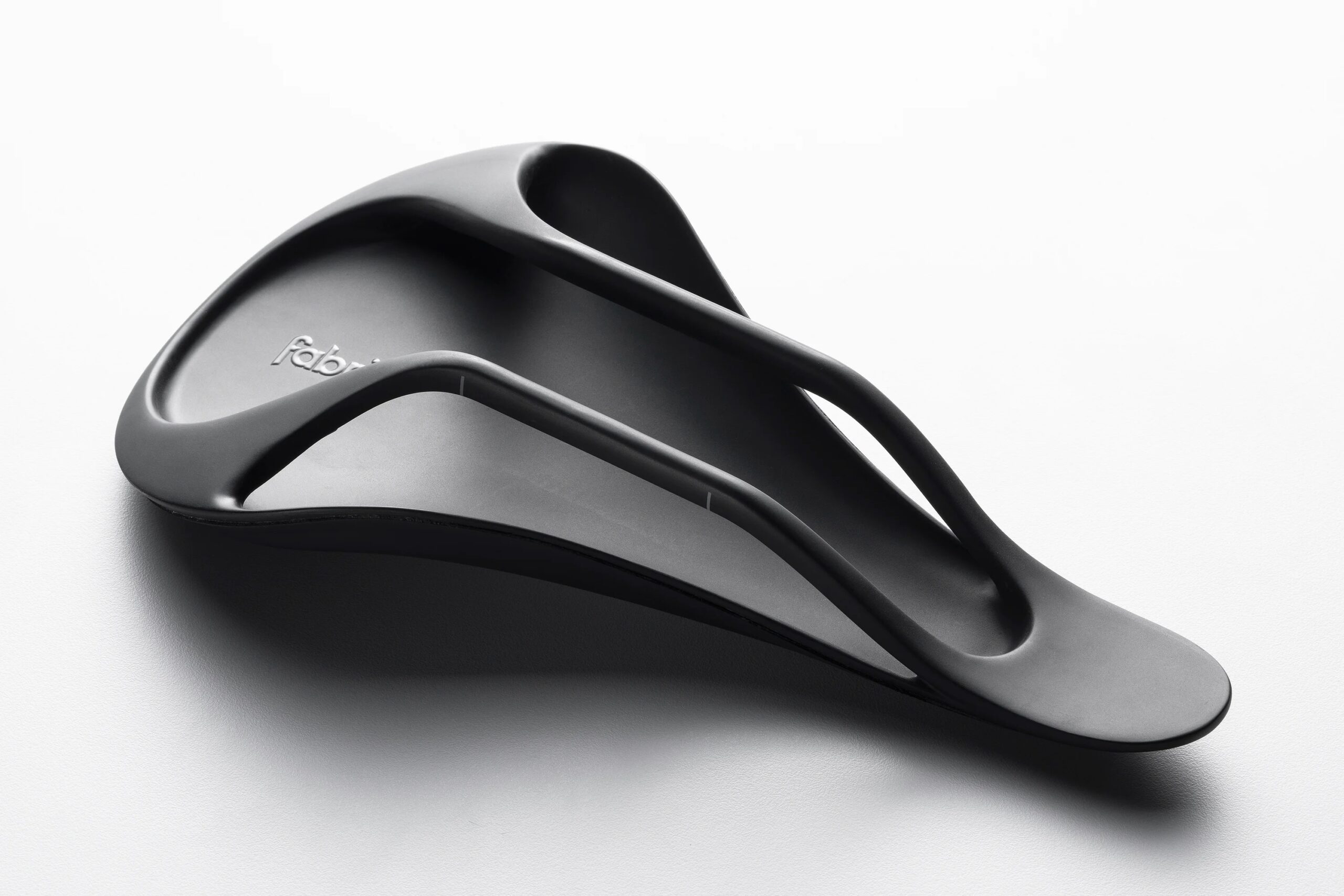 studio image of the bottom of the Fabric ALM:HALO bike saddle showing the base and saddle rails