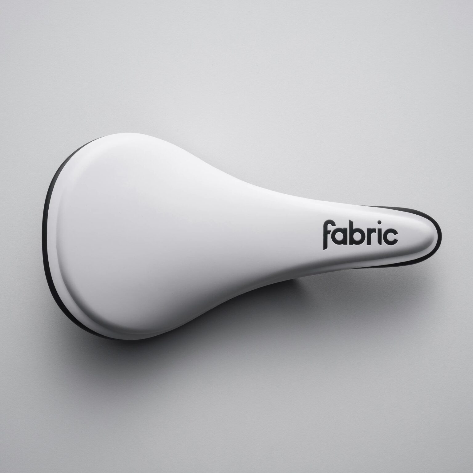 studio image of the Fabric ALM:HALO saddle in white
