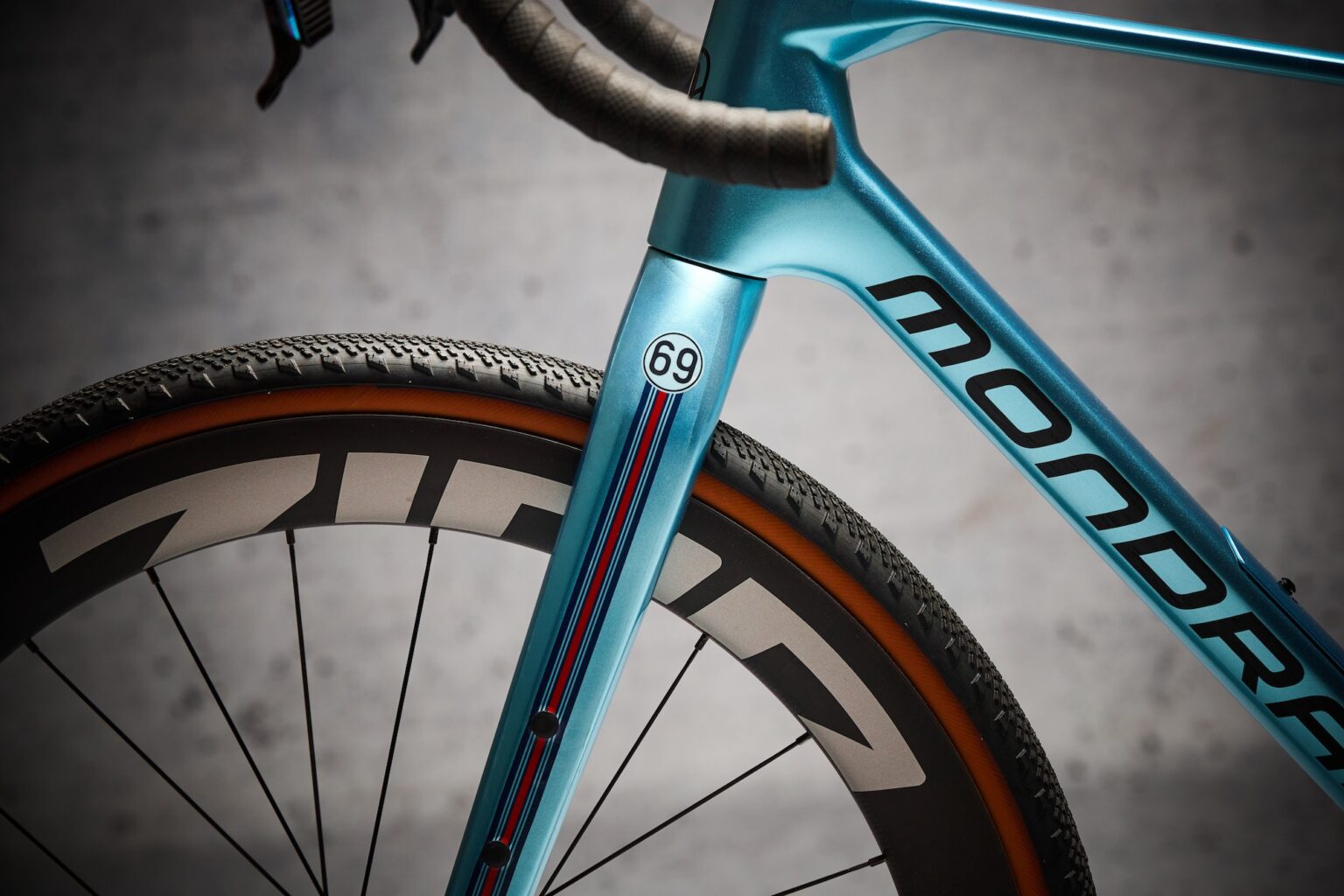 studio image of the fork of a gravel bike with the DyedBro Racing kit installed